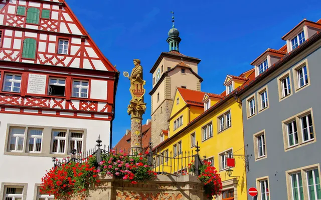 A lane of half-timbered houses with flowers in Rothenburg ob der Tauber