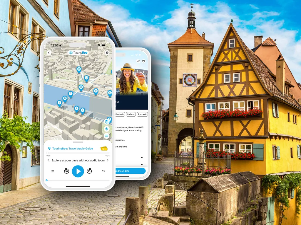 The TouringBee app open on a phone in front of the Plönlein in Rothenburg ob der Tauber